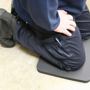 Man kneeling on a black Knee Protector Mat