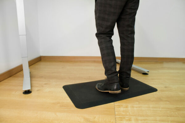 man standing on orthomat office mat