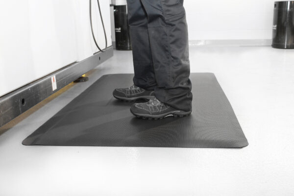Man standing on a lack Ramped Mat