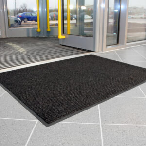 Charcoal Ribbed Carpet Doormat outside entry to a building