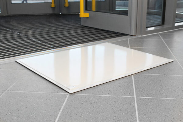 Sheeted Tack Cleaning Mat outside a building entrance