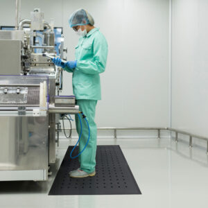 caucasian factory worker in blue lab suit on a solid hygienic Anti-Fatigue Mat